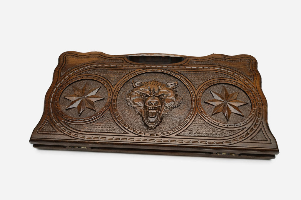 The backgammon board opened to show the wooden playing surface