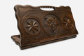 Carved beechwood backgammon board with a wolf and star medallions, with a carry handle, propped open
