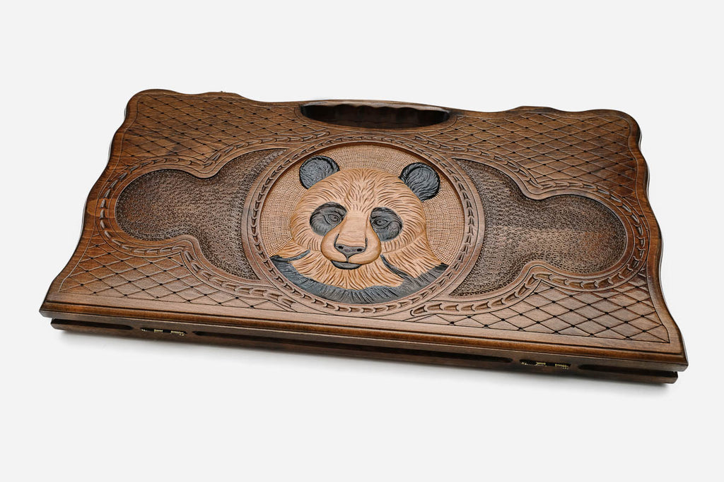 The backgammon board opened to show the wooden playing surface