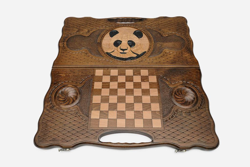 Angled view of the panda carved backgammon board