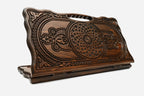 Carved beechwood backgammon board with two knotwork medallions and a carry handle, propped open