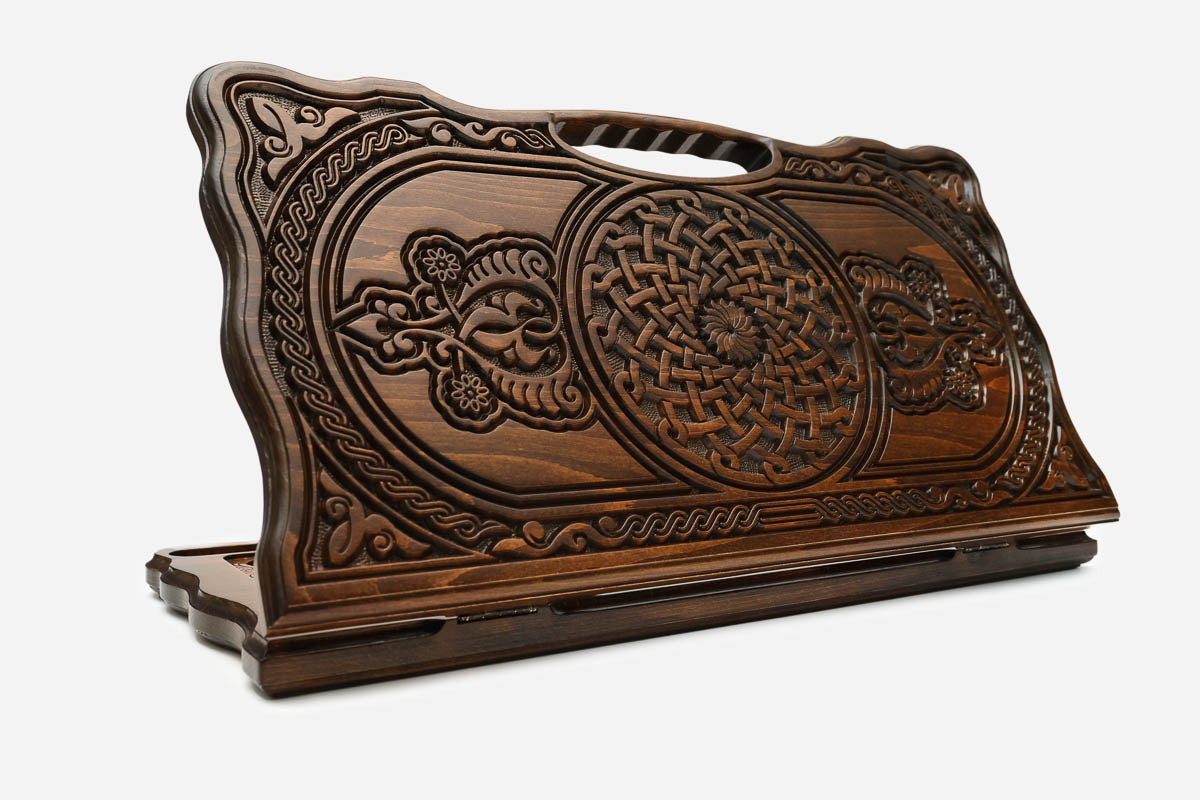 Carved beechwood backgammon board with two knotwork medallions and a carry handle, propped open