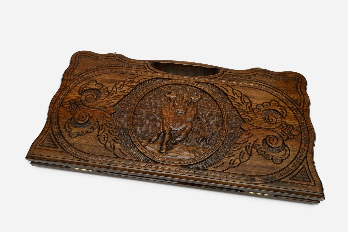 The backgammon board opened to show the wooden playing surface