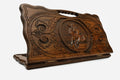 Carved beechwood backgammon board with an ox medallion and a carry handle, propped open