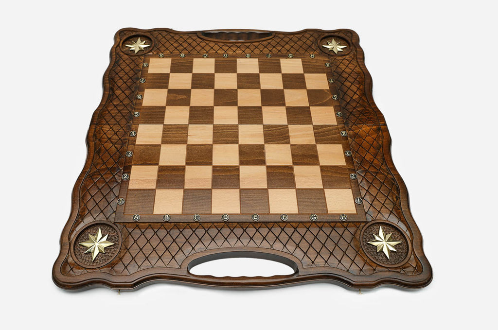 Overhead view of the full metal chess army on the inlaid board