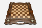 Overhead view of the full metal chess army on the inlaid board