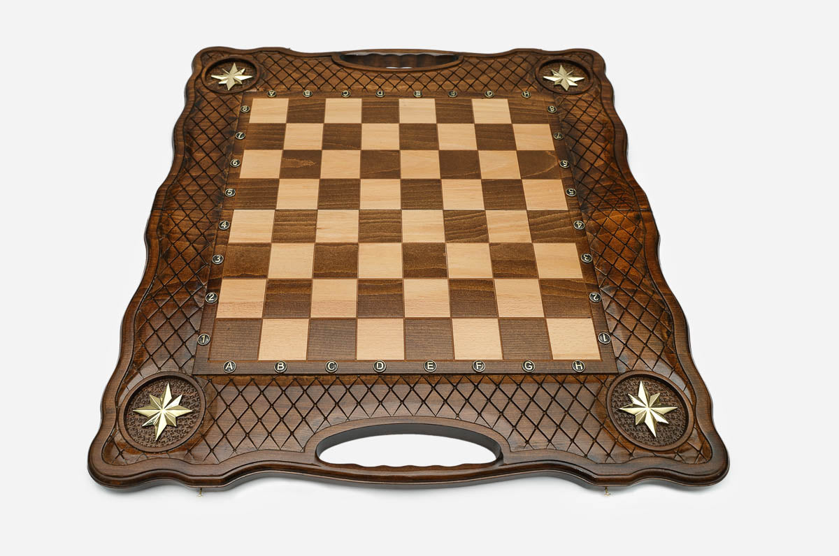 Overhead view of the full metal chess army on the inlaid board