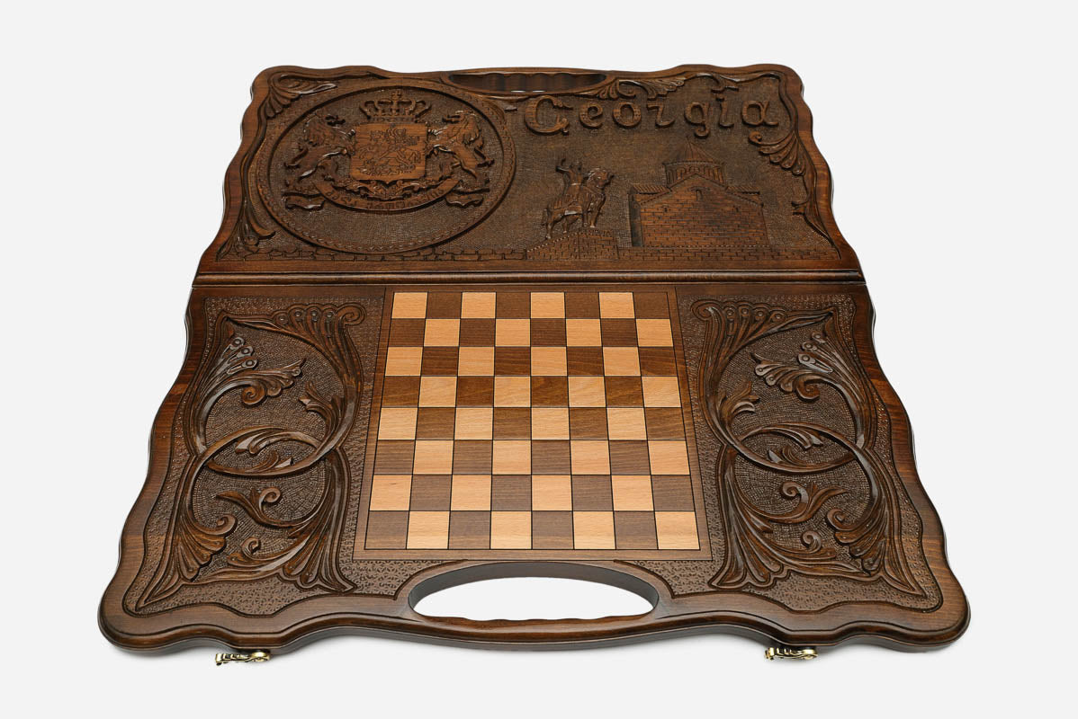 Angled view of the Georgia emblem carved backgammon board