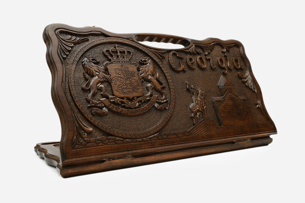 Carved beechwood backgammon board with the Georgian coat of arms and a carry handle, propped open