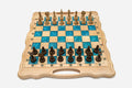 Folding chess board in pale wood with turquoise epoxy squares and ornately carved wooden pieces set up for play