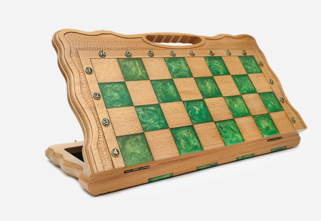 Angled view of the green epoxy folding chess set with its gold and dark bronze warrior pieces