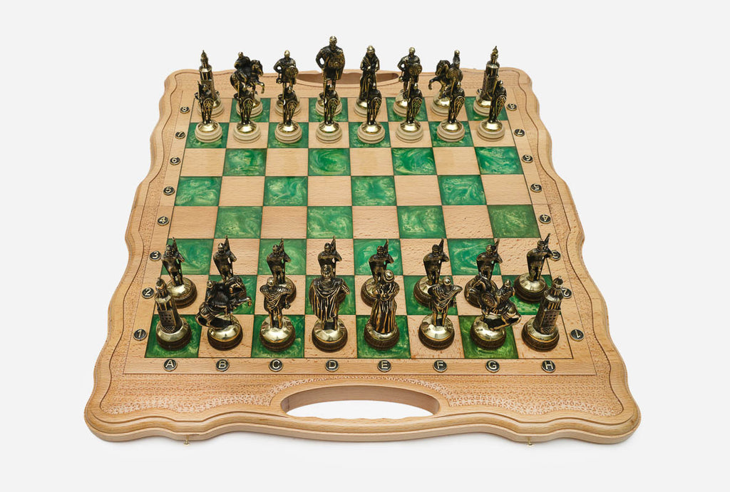 Light beechwood folding chess board with green marbled epoxy squares and ornate bronze figural soldier pieces