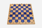 Overhead view of the blue epoxy board and full set of pieces