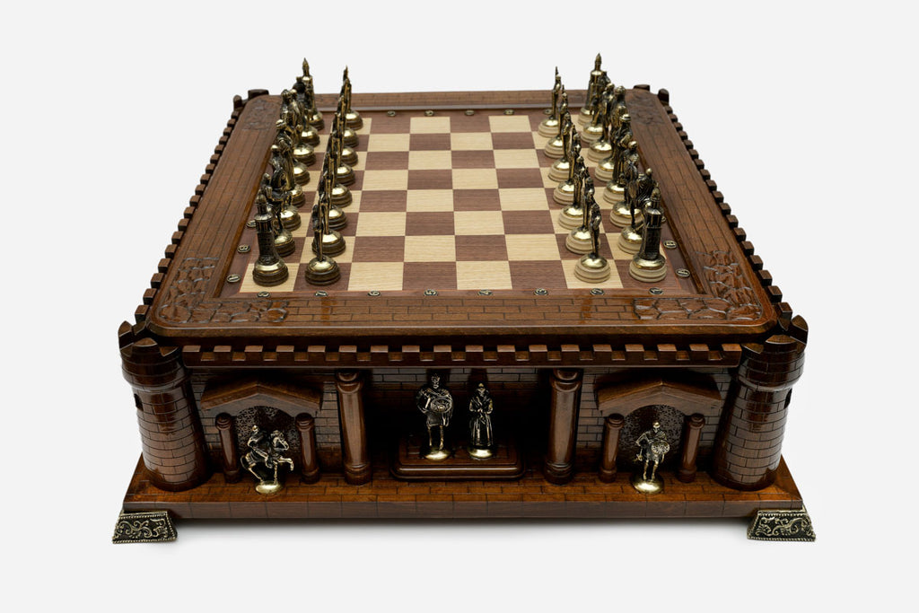 Handle Chess Castle with bronze pieces facing off in starting position, front view
