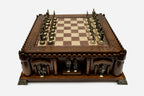 Castle chess set with bronze pieces facing off in starting position, front view