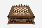 Castle chess set set up for play with bronze pieces, front angled view