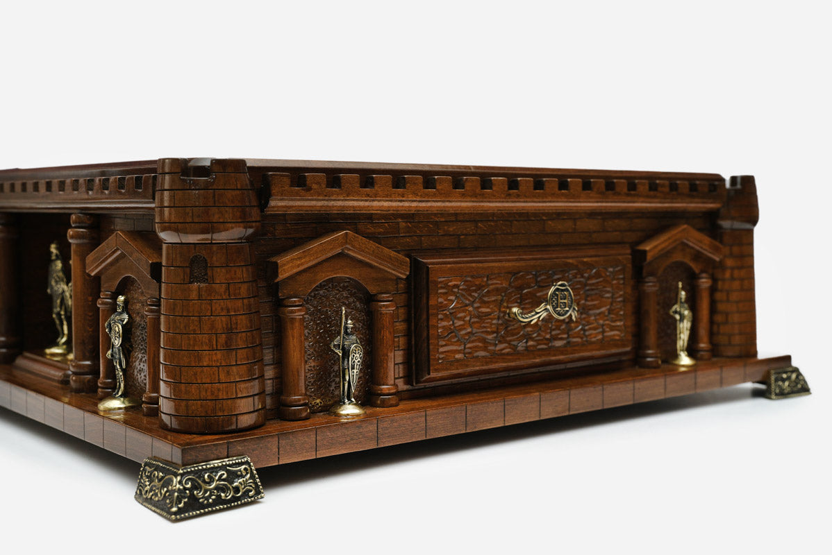 Close-up of the Chess Castle side wall with the carved drawer front and knight statues