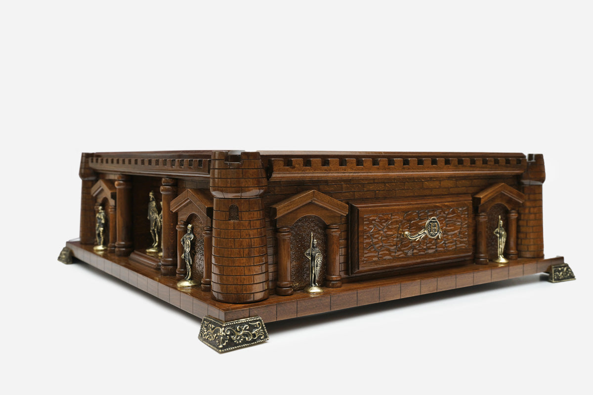 Close-up of the Chess Castle turret column and bronze knight figures in the archways