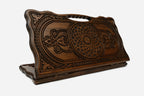 Carved beechwood backgammon board with twin floral and knotwork rosette medallions, with a carry handle, propped open