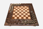 Detail of the deeply carved acanthus border framing the chessboard