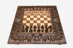Angled view of the grand carved chess set with its bronze figural pieces