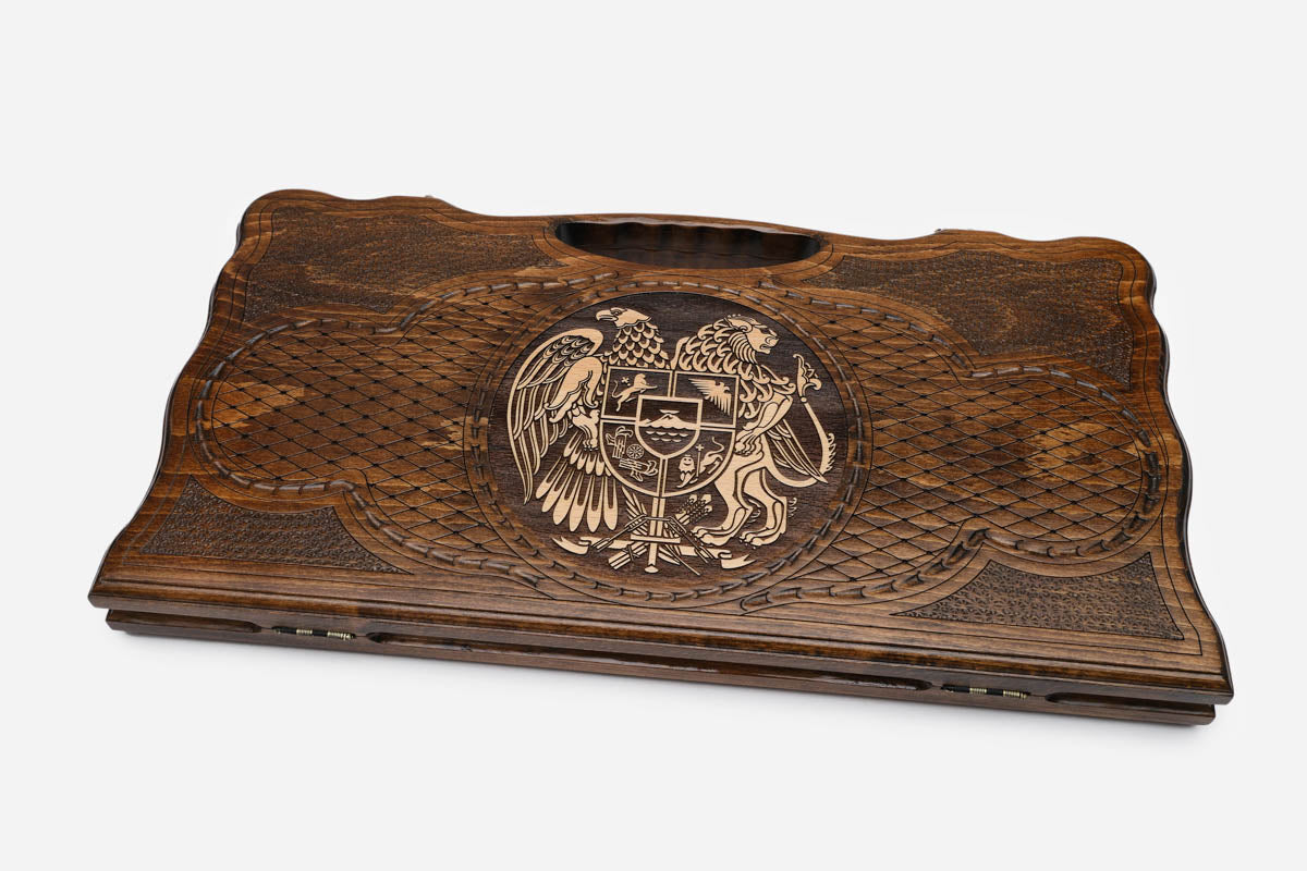 The backgammon board opened to show the wooden playing surface