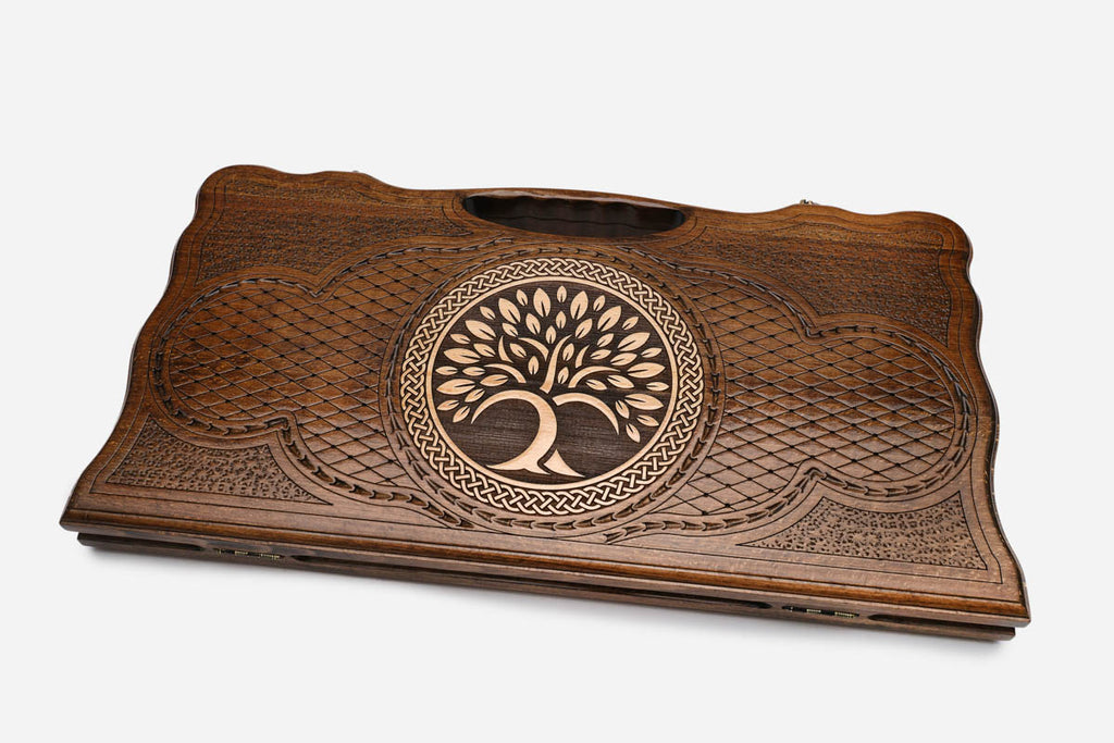 The backgammon board opened to show the wooden playing surface