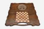 Angled view of the tree of life medallion carved backgammon board