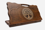 Carved beechwood backgammon board with a tree of life in a circular medallion, with a carry handle, propped open