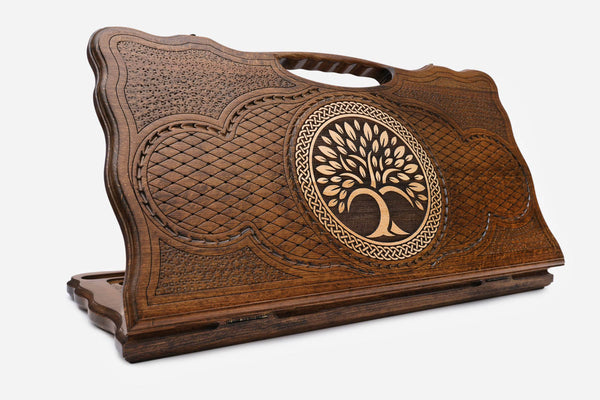 Carved beechwood backgammon board with a tree of life in a circular medallion, with a carry handle, propped open