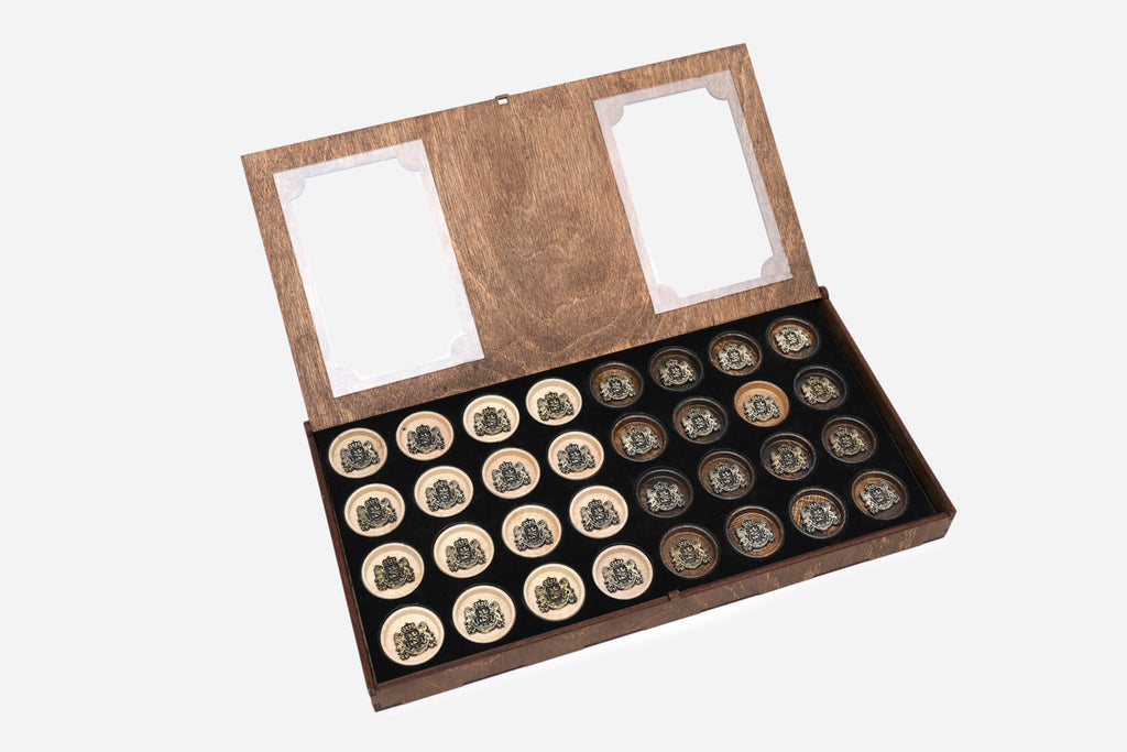 Open storage tray of Georgian coat of arms backgammon checkers on the Handle table