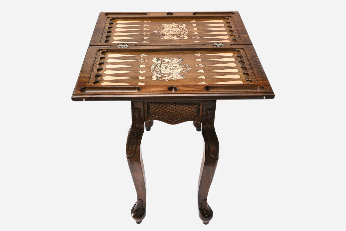 Close-up of the crowned coat of arms medallion on the Handle backgammon table lid