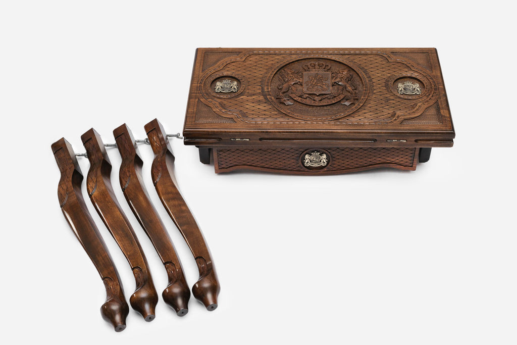 Close-up of the backgammon checkers, dice and cup on the Handle Georgian Coat of Arms table