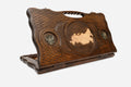 Carved beechwood backgammon board with the map of Russia and bronze eagle medallions, with a carry handle, propped open