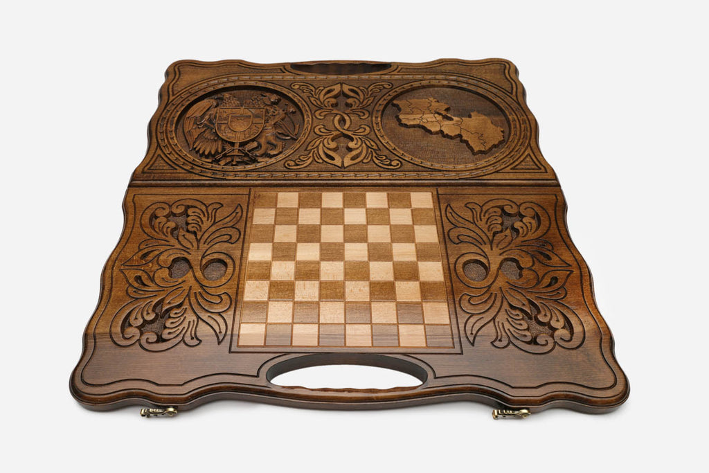 Angled view of the Armenia coat of arms and map carved backgammon board