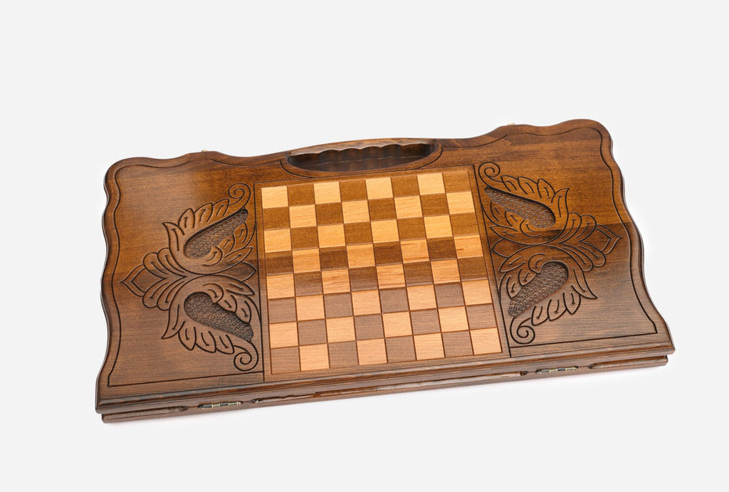 The backgammon board opened to show the wooden playing surface