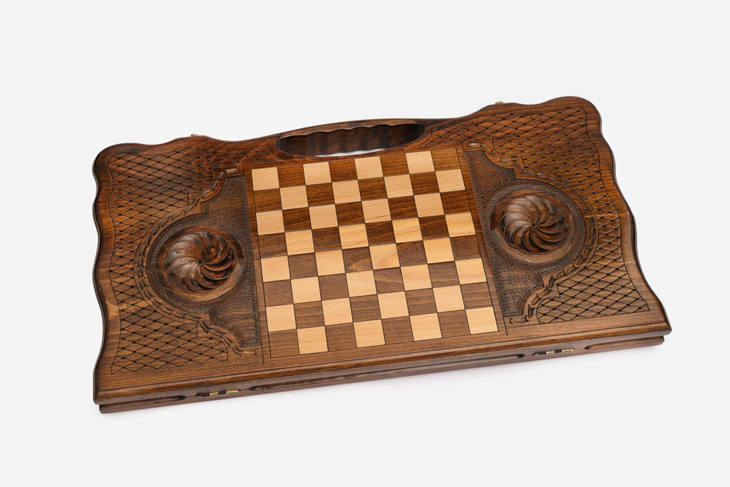 The backgammon board opened to show the wooden playing surface