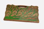 Close-up of the green epoxy tree branches on the walnut surface