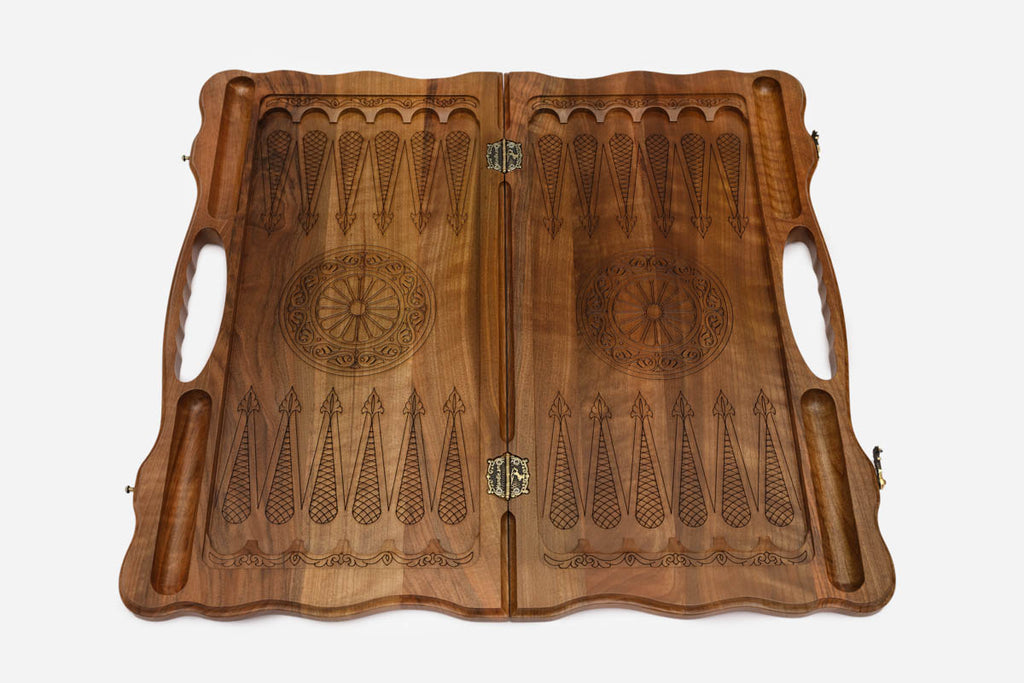The board opened to show the green tree halves and carry handle