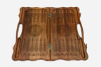 The board opened to show the green tree halves and carry handle