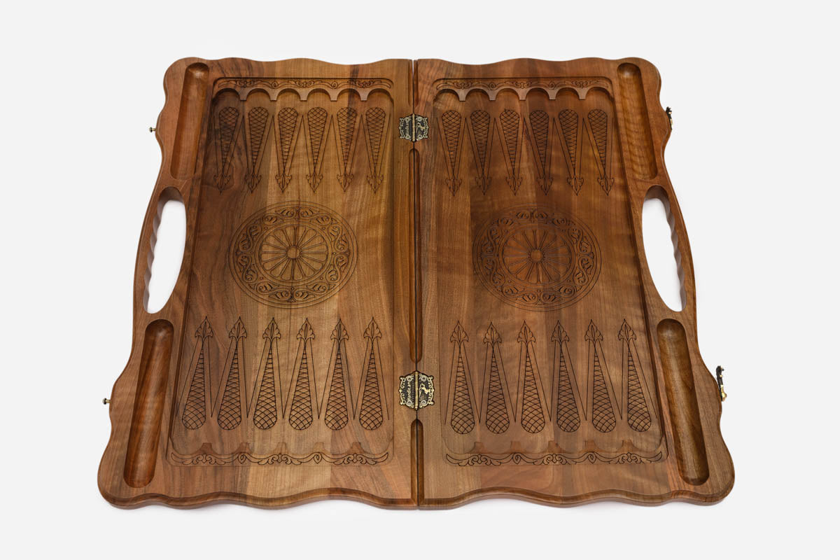 The board opened to show the green tree halves and carry handle