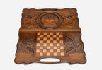 The backgammon board opened to show the wooden playing surface
