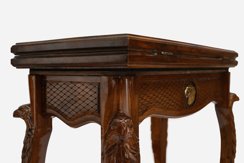 Close-up of the carved eagle head on the Handle backgammon table lid