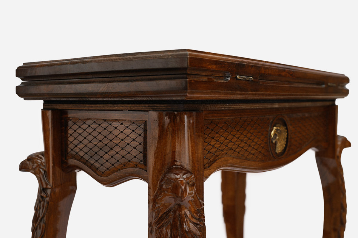 Close-up of the carved eagle head on the Handle backgammon table lid