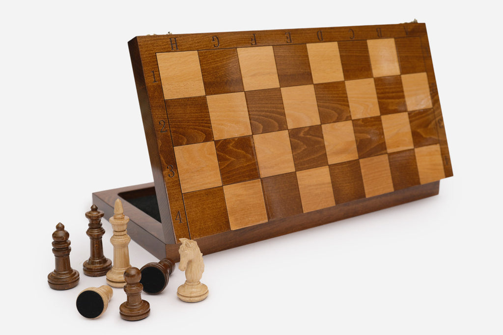 Classic chess set shown folded with carry handle