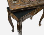 Close-up of the bronze pomegranate medallion on the Handle backgammon table lid