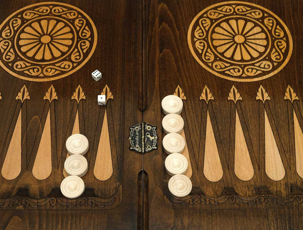 Handle Pomegranate Bronze backgammon table opened flat with checkers set up, top-down view