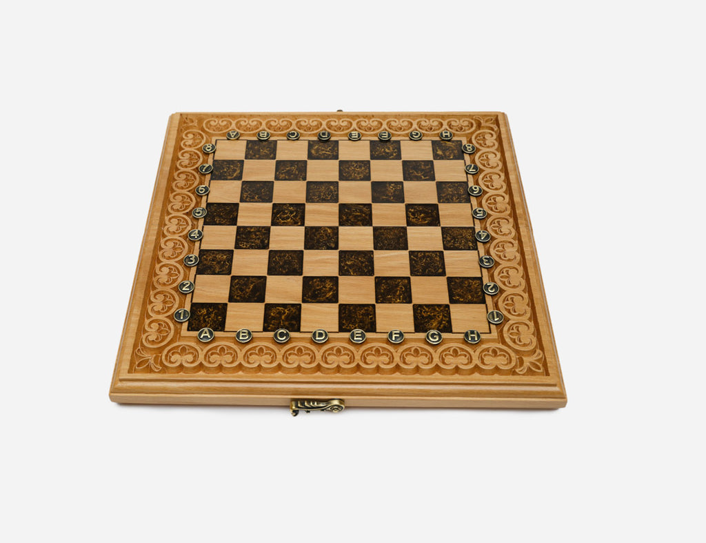 The empty brown epoxy chessboard showing its carved border