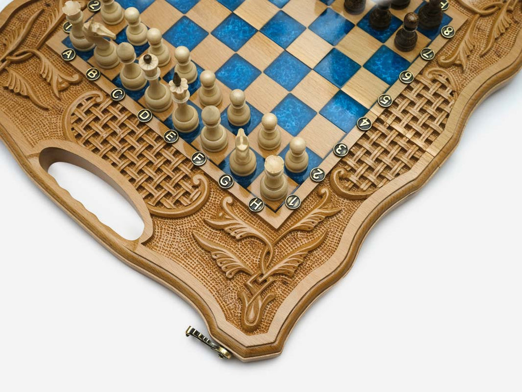 Close-up of the blue epoxy squares, carved wheat-and-basket-weave border and carry-handle cutout