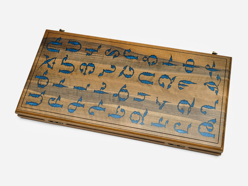 Folding walnut backgammon board with the Armenian alphabet inlaid in blue epoxy across the closed exterior
